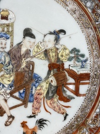A Chinese famille rose plate with musicians playing the drums, Yongzheng