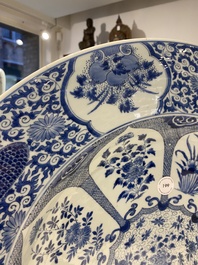 An exceptionally large Chinese blue and white 'peacock rim' dish, Kangxi