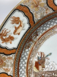 A Chinese famille rose plate with musicians playing the drums, Yongzheng