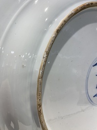 An exceptionally large Chinese blue and white 'peacock rim' dish, Kangxi