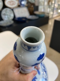 A Chinese blue and white bottle vase with floral designs, Transitional period