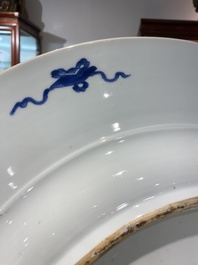 An exceptionally large Chinese blue and white 'peacock rim' dish, Kangxi