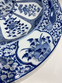 An exceptionally large Chinese blue and white 'peacock rim' dish, Kangxi