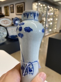 A Chinese blue and white bottle vase with floral designs, Transitional period