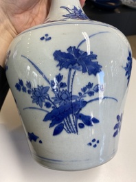 A Chinese blue and white bottle vase with floral designs, Transitional period
