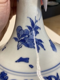 A Chinese blue and white bottle vase with floral designs, Transitional period