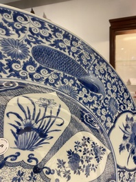 An exceptionally large Chinese blue and white 'peacock rim' dish, Kangxi