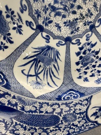An exceptionally large Chinese blue and white 'peacock rim' dish, Kangxi