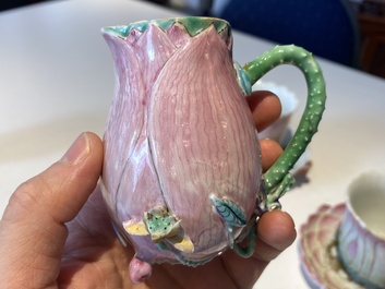 Two Chinese relief-decorated famille rose 'lotus' cups and saucers and two jugs, Yongzheng