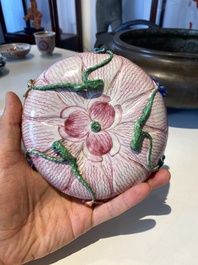 Two Chinese relief-decorated famille rose 'lotus' cups and saucers and two jugs, Yongzheng