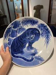 A large Japanese Arita blue and white 'tiger' dish, Fuuki Chousun 富貴長春 mark, 18/19th C.