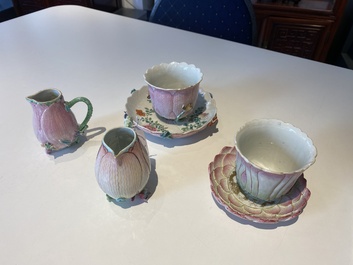 Two Chinese relief-decorated famille rose 'lotus' cups and saucers and two jugs, Yongzheng