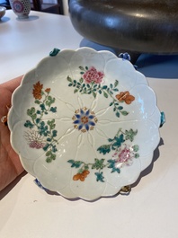 Two Chinese relief-decorated famille rose 'lotus' cups and saucers and two jugs, Yongzheng