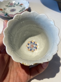 Two Chinese relief-decorated famille rose 'lotus' cups and saucers and two jugs, Yongzheng