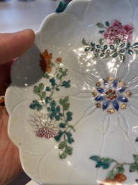 Two Chinese relief-decorated famille rose 'lotus' cups and saucers and two jugs, Yongzheng