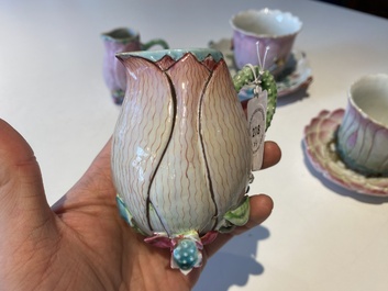 Two Chinese relief-decorated famille rose 'lotus' cups and saucers and two jugs, Yongzheng
