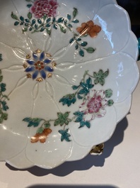 Two Chinese relief-decorated famille rose 'lotus' cups and saucers and two jugs, Yongzheng