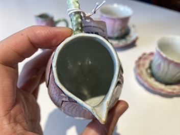 Two Chinese relief-decorated famille rose 'lotus' cups and saucers and two jugs, Yongzheng