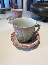 Two Chinese relief-decorated famille rose 'lotus' cups and saucers and two jugs, Yongzheng