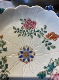 Two Chinese relief-decorated famille rose 'lotus' cups and saucers and two jugs, Yongzheng