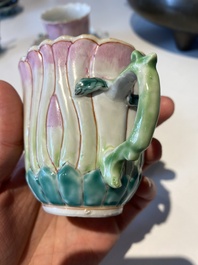 Two Chinese relief-decorated famille rose 'lotus' cups and saucers and two jugs, Yongzheng