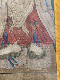 Chinese school: 'Buddha standing on two lotus flowers', ink and colour on silk, 18/19th C.