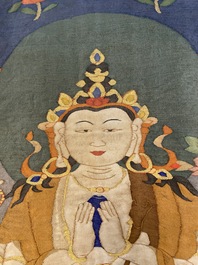 A Chinese kesi silk weaving depicting 'Buddha sitting on a lotus throne', Qing