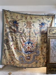 A large Chinese yellow-ground silk embroidery decorated with three five-clawed dragons, 19th C.