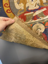 A Chinese kesi silk weaving depicting 'Buddha sitting on a lotus throne', Qing