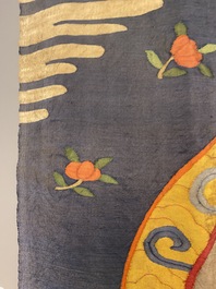 A Chinese kesi silk weaving depicting 'Buddha sitting on a lotus throne', Qing