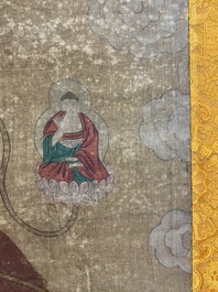 Chinese school: 'Buddha standing on two lotus flowers', ink and colour on silk, 18/19th C.