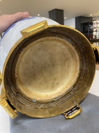 A large Chinese blue and white crackle-glazed 'carps' vase with fine gilt bronze mounts, 18/19th C.