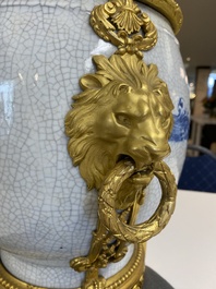 A large Chinese blue and white crackle-glazed 'carps' vase with fine gilt bronze mounts, 18/19th C.