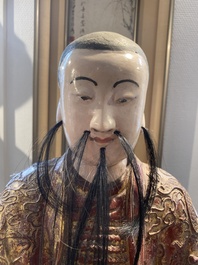 A large Chinese lacquered and polychromed wood sculpture of Guandi, 18th C.