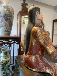 A large Chinese lacquered and polychromed wood sculpture of Guandi, 18th C.