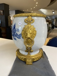 A large Chinese blue and white crackle-glazed 'carps' vase with fine gilt bronze mounts, 18/19th C.
