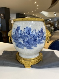 A large Chinese blue and white crackle-glazed 'carps' vase with fine gilt bronze mounts, 18/19th C.