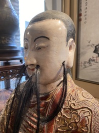 A large Chinese lacquered and polychromed wood sculpture of Guandi, 18th C.