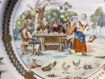 A pair of Chinese famille rose plates with peasants playing cards in the style of the painter David Teniers II, Qianlong