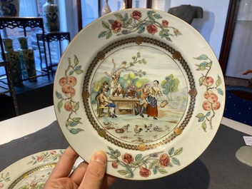 A pair of Chinese famille rose plates with peasants playing cards in the style of the painter David Teniers II, Qianlong