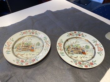 A pair of Chinese famille rose plates with peasants playing cards in the style of the painter David Teniers II, Qianlong