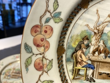 A pair of Chinese famille rose plates with peasants playing cards in the style of the painter David Teniers II, Qianlong