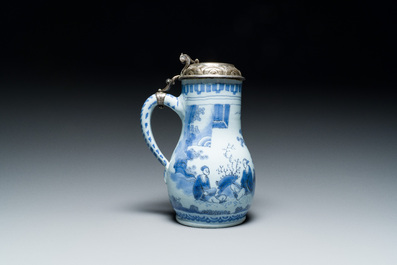 A Dutch Delft blue and white chinoiserie jug with silver lid, 17th C.