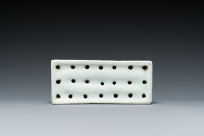 A pair of Japanese blue and white plates and a rectangular pounce pot, Arita, Edo, 18th C.