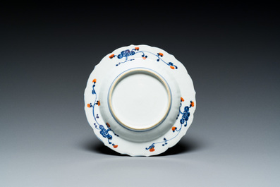 A Chinese clobbered blue and white ewer, a plate and a verte biscuit teapot, Kangxi