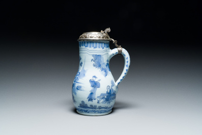 A Dutch Delft blue and white chinoiserie jug with silver lid, 17th C.