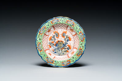 A Chinese clobbered blue and white ewer, a plate and a verte biscuit teapot, Kangxi