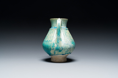 A turquoise-glazed jug, Kashan, Persia, 13th C.
