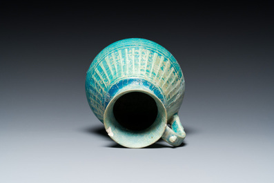 A turquoise-glazed jug, Kashan, Persia, 13th C.