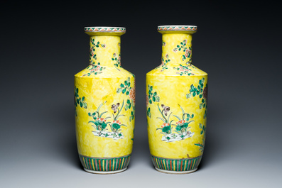 A pair of Chinese yellow-ground famille verte rouleau vases, 19th C.